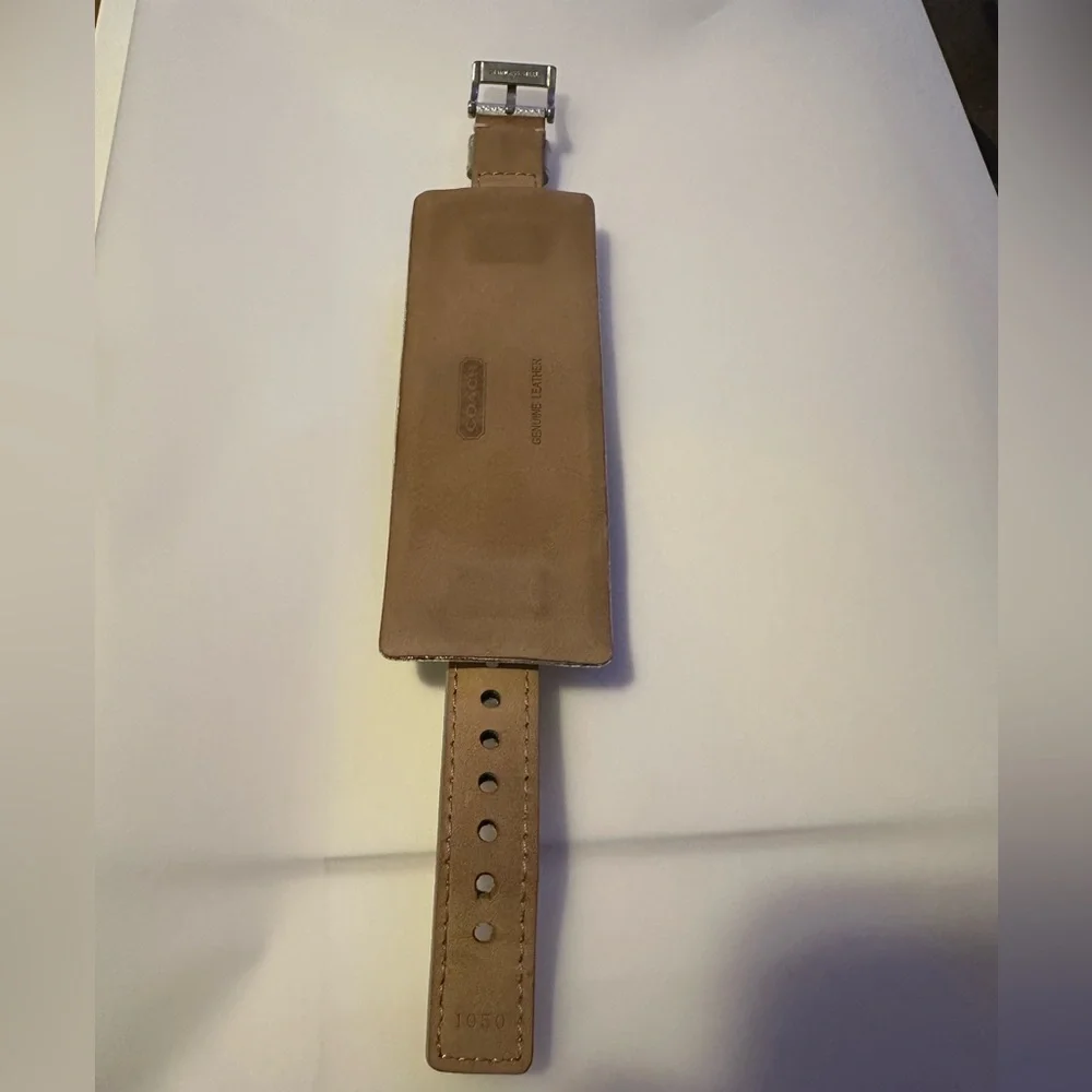 Coach Poppy cuff watch. Genuine leather with silver metallic‎ design. Vintage